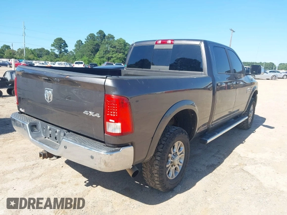 2015 Ram 2500 Laramie z VIN 3C6UR5FL6FG708769, wystawiony jako IAAI lot #42299173 z przebiegiem 101 660 mil mil oraz . Historia ofert i sprzedaży dostępna na DreamBid. Obrazek 4.