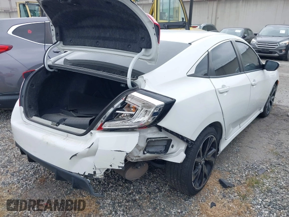2019 Honda Civic Sport with VIN 2HGFC2F85KH512587, listed as a IAAI auction lot 41708347 with 63,895 mi miles and . Bid and sale history available at DreamBid. Image 4.