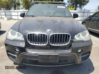 2012 BMW X5 35i z VIN 5UXZV4C51CL744313, wystawiony jako Copart lot #58270755 z przebiegiem 97 903 mil mil oraz Szkoda całkowita • Salvage title. Historia ofert i sprzedaży dostępna na DreamBid. Obrazek 5.