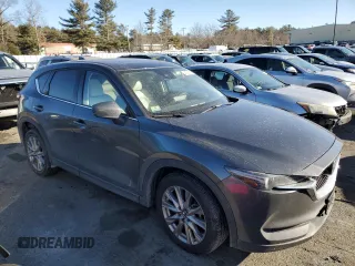 2021 Mazda CX-5 Grand Touring with VIN JM3KFBDM9M0490239, listed as a Copart auction lot 43306975 with 47,010 mi miles and Salvage Title. Bid and sale history available at carsss.com. Image 4.