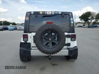2013 Jeep Wrangler Unlimited Sahara with VIN 1C4BJWEG4DL536694, listed as a Copart auction lot 57714035 with 146,257 mi miles and Salvage title. Bid and sale history available at DreamBid. Image 6.