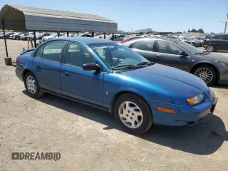 2000 Saturn SL with VIN 1G8ZK5271YZ184701, listed as a Copart auction lot 61598135 with 123,309 mi miles and Salvage title. Bid and sale history available at DreamBid. Image 4.