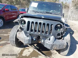 2012 Jeep Wrangler Unlimited Sport with VIN 1C4BJWDG5CL209978, listed as a IAAI auction lot 41662081 with 202,282 mi miles. Bid and sale history available at carsss.com. Image 6.