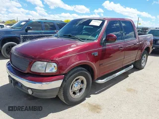 2003 Ford F-150 XLT with VIN 1FTRW07693KC11903, listed as a IAAI auction lot 41993455 with 301,023 mi miles. Bid and sale history available at carsss.com. Image 2.