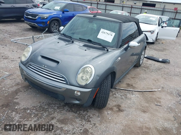 2006 MINI Convertible S with VIN WMWRH33586TF87791, listed as a IAAI auction lot 42679478 with 90,209 mi miles and . Bid and sale history available at DreamBid. Image 2.