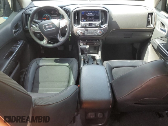 2021 GMC Canyon 4WD AT4 w/Leather with VIN 1GTG6FEN3M1274409, listed as a Copart auction lot 49228145 with 57,194 mi miles and Salvage Title. Bid and sale history available at carsss.com. Image 8.