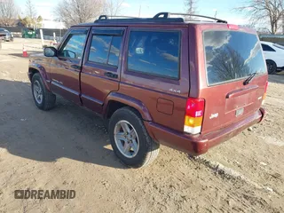2000 Jeep Cherokee Classic with VIN 1J4FF58S7YL122676, listed as a IAAI auction lot 41710310 with 124,758 mi miles. Bid and sale history available at carsss.com. Image 3.