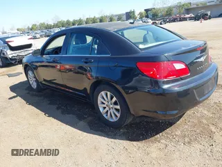 2010 Chrysler Sebring Limited with VIN 1C3CC5FB8AN140459, listed as a IAAI auction lot 41657740 with 199,682 mi miles and . Bid and sale history available at DreamBid. Image 3.