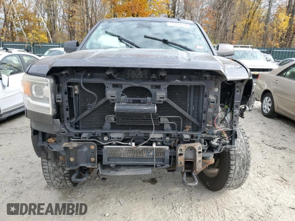 2015 GMC Sierra 2500HD SLT with VIN 1GT12ZEG1FF180216, listed as a Copart auction lot 77076384 with 67,751 mi miles and Salvage title. Bid and sale history available at DreamBid. Image 5.
