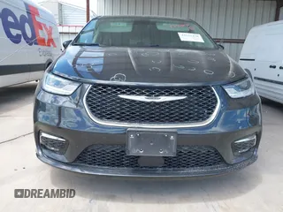 2023 Chrysler Pacifica Touring L with VIN 2C4RC1BG1PR550628, listed as a IAAI auction lot 42553430 with 61,773 mi miles and . Bid and sale history available at DreamBid. Image 6.