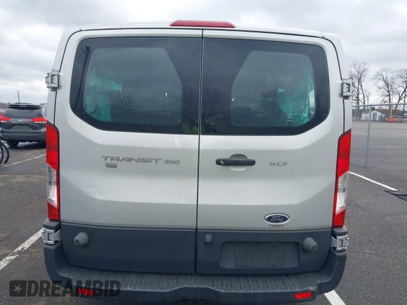 2018 Ford Transit Passenger XL z VIN 1FBZX2ZM2JKB02141, wystawiony jako IAAI lot #41914073 z przebiegiem 103 718 mil mil oraz . Historia ofert i sprzedaży dostępna na DreamBid. Obrazek 16.