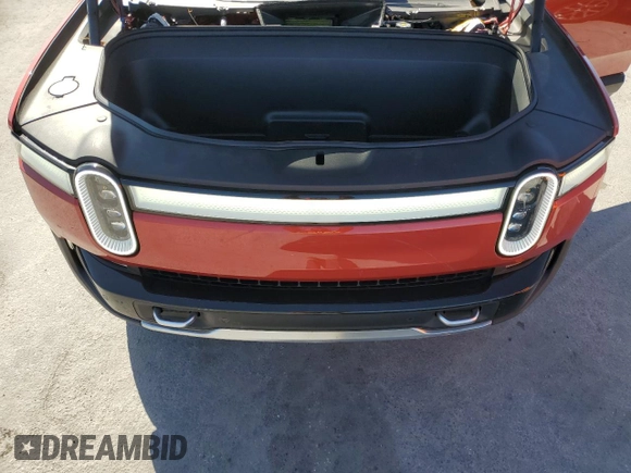 2024 Rivian R1T Adventure z VIN 7FCTGCAA3RN030346, wystawiony jako Copart lot #49440515 z przebiegiem 12 772 mil mil oraz Szkoda całkowita • Salvage title. Historia ofert i sprzedaży dostępna na DreamBid. Obrazek 11.