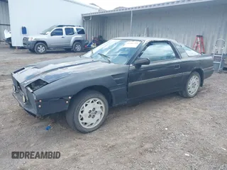 1986 Toyota Supra z VIN JT2MA70L4G0010843, wystawiony jako IAAI lot #41966751 z przebiegiem 205 187 mil mil oraz . Historia ofert i sprzedaży dostępna na DreamBid. Obrazek 2.