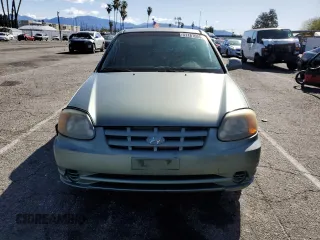 2004 Hyundai Accent GL with VIN KMHCG45C44U533952, listed as a Copart auction lot 51181095 with 88,446 mi miles and Salvage Title. Bid and sale history available at carsss.com. Image 5.