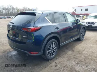 2018 Mazda CX-5 Grand Touring with VIN JM3KFBDM3J0377866, listed as a IAAI auction lot 41947014 with 70,446 mi miles. Bid and sale history available at carsss.com. Image 4.