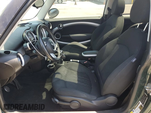 2009 MINI Hardtop S with VIN WMWMF73599TT96423, listed as a Copart auction lot 63913415 with 103,165 mi miles and Clean title. Bid and sale history available at DreamBid. Image 7.