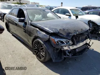 2014 Mercedes-Benz E 550 Sport with VIN WDDHF9BB8EA853354, listed as a Copart auction lot 56666184 with 127,145 mi miles and Salvage Title. Bid and sale history available at DreamBid. Image 4.