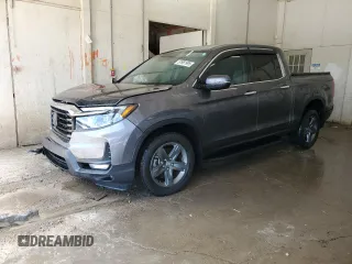 2023 Honda Ridgeline RTL-E with VIN 5FPYK3F77PB043319, listed as a Copart auction lot 57981995 with 37,284 mi miles and Salvage title. Bid and sale history available at DreamBid. Image 1.