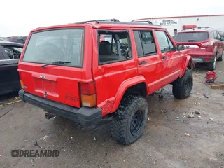1996 Jeep Cherokee Sport with VIN 1J4FJ68S6TL299152, listed as a IAAI auction lot 41004736 with 277,819 mi miles. Bid and sale history available at carsss.com. Image 4.