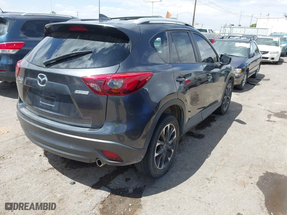 2016 Mazda CX-5 Grand Touring with VIN JM3KE4DY7G0643643, listed as a IAAI auction lot 42077497 with 120,343 mi miles. Bid and sale history available at carsss.com. Image 4.