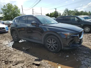 2018 Mazda CX-5 Grand Touring with VIN JM3KFBDM6J0345848, listed as a Copart auction lot 61587865 with 107,193 mi miles and Salvage title. Bid and sale history available at DreamBid. Image 4.