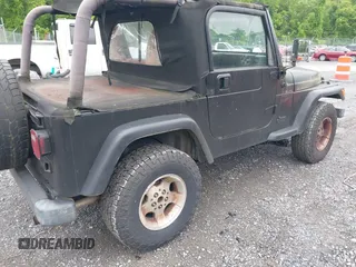 2000 Jeep Wrangler Sport z VIN 1J4FA49S1YP700545, wystawiony jako IAAI lot #42367828 z przebiegiem 214 698 mil mil oraz . Historia ofert i sprzedaży dostępna na DreamBid. Obrazek 4.