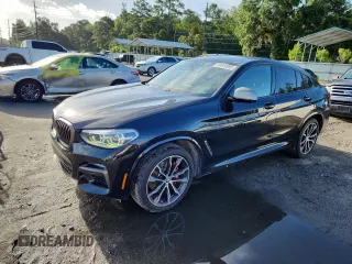 2021 BMW X4 M40i with VIN 5UX2V5C05M9F68427, listed as a Copart auction lot 64941095 with 50,208 mi miles and Salvage title. Bid and sale history available at DreamBid. Image 1.