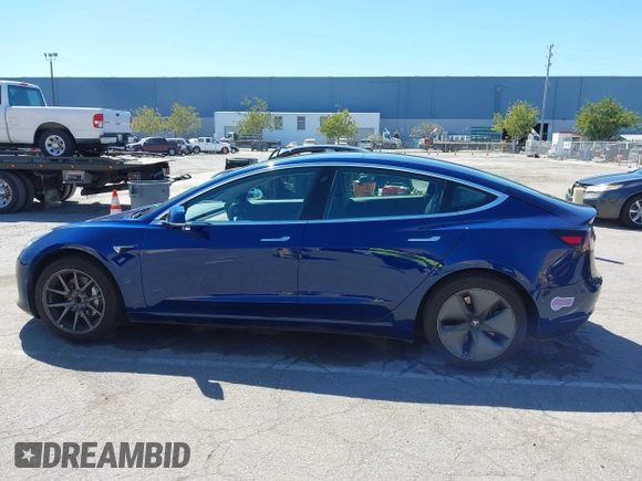 2019 Tesla Model 3 Mid Range with VIN 5YJ3E1EA0KF425079, listed as a IAAI auction lot 41871022 with 61,684 mi miles and . Bid and sale history available at DreamBid. Image 14.