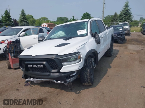 2022 Ram 1500 Rebel with VIN 1C6SRFLT5NN318494, listed as a IAAI auction lot 42413194 with 59,458 mi miles and . Bid and sale history available at DreamBid. Image 6.