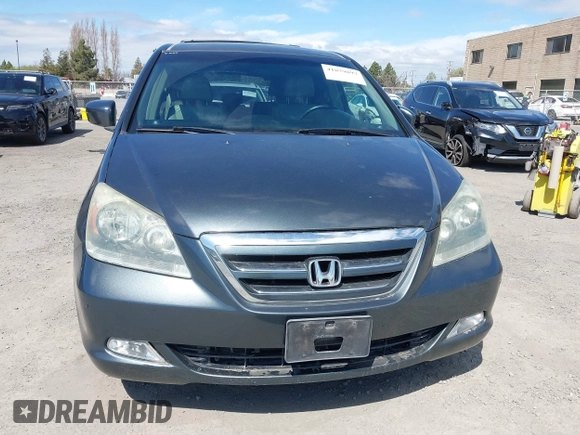 2005 Honda Odyssey TOURING with VIN 5FNRL38885B082482, listed as a IAAI auction lot 41879897 with 159,667 mi miles. Bid and sale history available at carsss.com. Image 12.