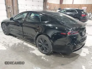 2022 Tesla Model S with VIN 5YJSA1E58NF478403, listed as a IAAI auction lot 41533099 with 42,779 mi miles and . Bid and sale history available at DreamBid. Image 3.