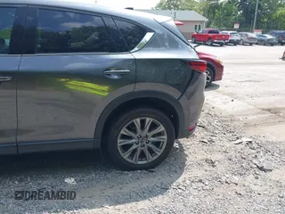 2020 Mazda CX-5 Grand Touring with VIN JM3KFBDM1L0821975, listed as a IAAI auction lot 40088794 with 68,895 mi miles and . Bid and sale history available at DreamBid. Image 19.
