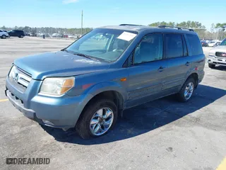 2006 Honda Pilot EX-L with VIN 5FNYF18526B028206, listed as a IAAI auction lot 41696355 with 282,779 mi miles. Bid and sale history available at carsss.com. Image 2.