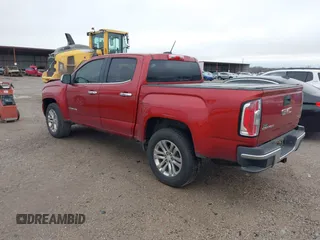 2015 GMC Canyon 2WD SLT with VIN 1GTG5CE3XF1211164, listed as a IAAI auction lot 41490387 with 163,932 mi miles. Bid and sale history available at carsss.com. Image 3.