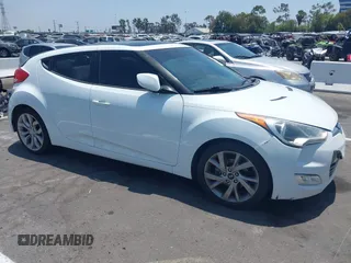 2012 Hyundai Veloster w/Black Int with VIN KMHTC6AD5CU056209, listed as a IAAI auction lot 42565571 with 137,908 mi miles and . Bid and sale history available at DreamBid. Image 1.