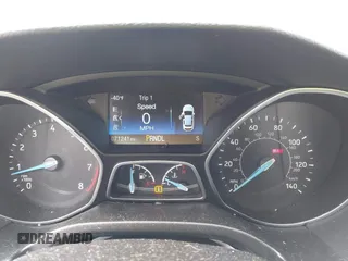 2018 Ford Focus SE z VIN 1FADP3F2XJL293337, wystawiony jako IAAI lot #42121294 z przebiegiem 71 241 mil mil oraz . Historia ofert i sprzedaży dostępna na DreamBid. Obrazek 7.