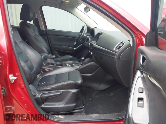 2016 Mazda CX-5 Grand Touring z VIN JM3KE2DY6G0693678, wystawiony jako IAAI lot #42443247 z przebiegiem 127 620 mil mil oraz . Historia ofert i sprzedaży dostępna na DreamBid. Obrazek 5.
