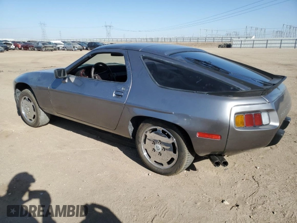 1985 Porsche 928 z VIN WP0JB0927FS862258, wystawiony jako Copart lot #71369064 z przebiegiem 32 896 mil mil oraz Szkoda całkowita • Salvage title. Historia ofert i sprzedaży dostępna na DreamBid. Obrazek 2.