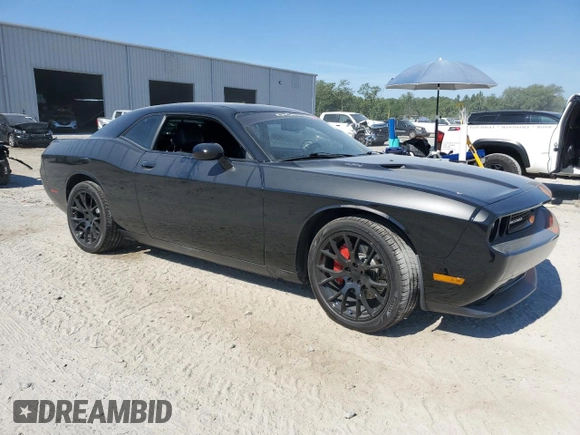 2014 Dodge Challenger R/T z VIN 2C3CDYBT6EH112199, wystawiony jako Copart lot #58023535 z przebiegiem 99 977 mil mil oraz Szkody całkowita. Historia ofert i sprzedaży dostępna na DreamBid. Obrazek 4.