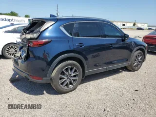 2018 Mazda CX-5 Grand Touring с VIN JM3KFBDM8J0344328, выставлен на аукционе Copart как лот 57665175 с пробегом 131 175 миль миль и Списание • Salvage title. История ставок и продаж доступна на DreamBid. Изображение 3.