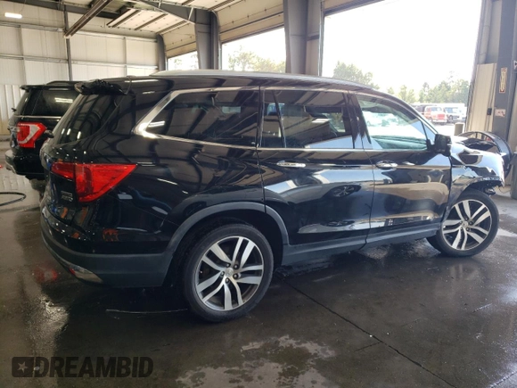 2017 Honda Pilot Touring with VIN 5FNYF6H97HB036935, listed as a Copart auction lot 71757334 with 68,641 mi miles and Salvage Title. Bid and sale history available at DreamBid. Image 3.