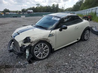 2012 MINI Coupe S z VIN WMWSX3C56CT154872, wystawiony jako Copart lot #68011264 z przebiegiem 91 650 mil mil oraz Szkody całkowita. Historia ofert i sprzedaży dostępna na DreamBid. Obrazek 1.