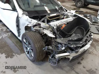2022 Tesla Model S with VIN 5YJSA1E59NF469984, listed as a IAAI auction lot 42426490 with Not provided miles and . Bid and sale history available at DreamBid. Image 6.