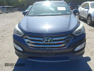 2014 Hyundai Santa Fe z VIN 5XYZUDLB1EG165458, wystawiony jako IAAI lot #42107789 z przebiegiem 94 395 mil mil oraz . Historia ofert i sprzedaży dostępna na DreamBid. Obrazek 12.