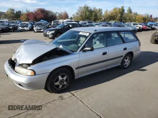 1997 Subaru Legacy L with VIN 4S3BK4353V7309736, listed as a Copart auction lot 77916284 with 235,708 mi miles and Salvage title. Bid and sale history available at DreamBid. Image 1.