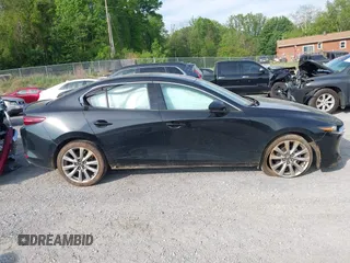 2021 Mazda 3 Premium z VIN 3MZBPADL2MM254467, wystawiony jako IAAI lot #42151557 z przebiegiem 63 282 mil mil oraz . Historia ofert i sprzedaży dostępna na DreamBid. Obrazek 14.