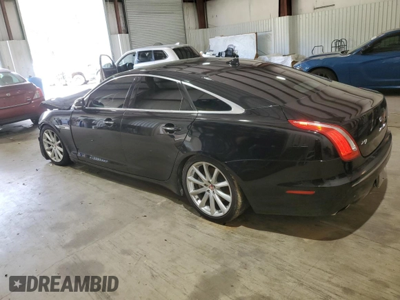 2014 Jaguar XJ with VIN SAJWA1CZ0E8V61168, listed as a Copart auction lot 54383215 with 137,724 mi miles and Salvage Title. Bid and sale history available at DreamBid. Image 2.