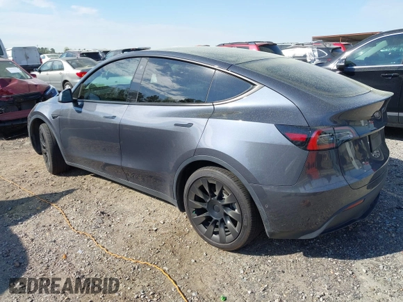 2022 Tesla Model Y Long Range z VIN 7SAYGDEE7NA006476, wystawiony jako IAAI lot #41894606 z przebiegiem 63 380 mil mil oraz . Historia ofert i sprzedaży dostępna na DreamBid. Obrazek 3.