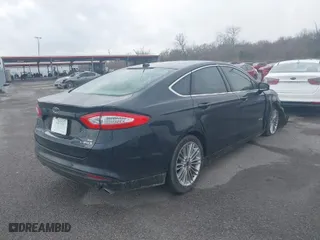 2014 Ford Fusion SE Hybrid with VIN 3FA6P0LU7ER282848, listed as a IAAI auction lot 41560449 with 180,696 mi miles. Bid and sale history available at carsss.com. Image 4.