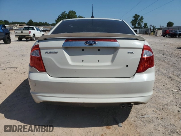 2012 Ford Fusion SEL z VIN 3FAHP0JA3CR336743, wystawiony jako Copart lot #45455065 z przebiegiem 126 456 mil mil oraz Szkody całkowita. Historia ofert i sprzedaży dostępna na DreamBid. Obrazek 6.